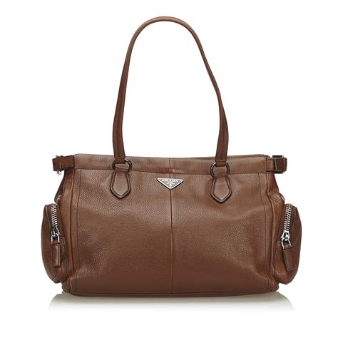 prada brown leather tote bag with gold metal handle|Prada nylon tote bag price.